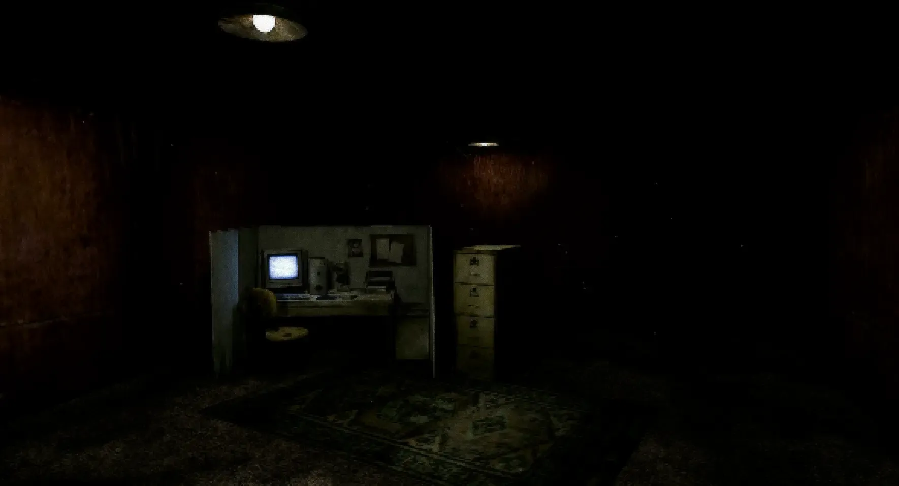 An office cubical with a CRT monitor in the same room.
